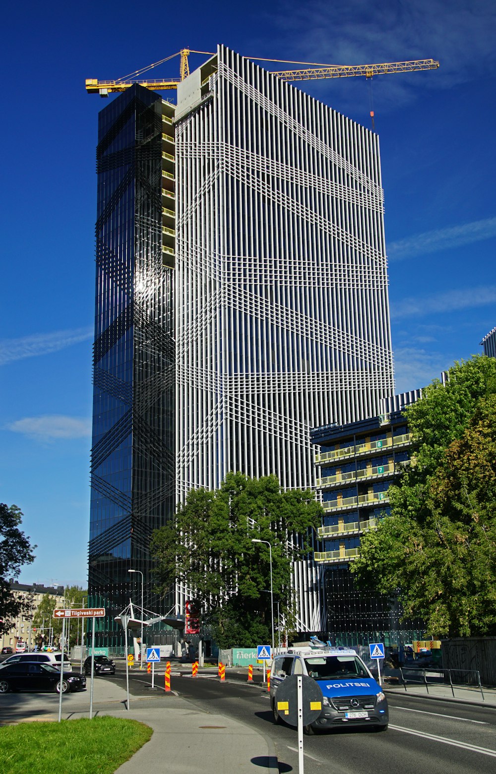 a very tall building with a crane on top of it