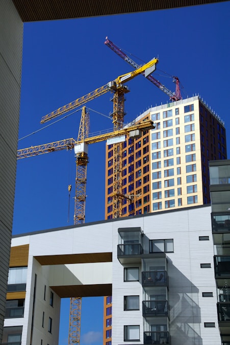 a building under construction with a crane in the background