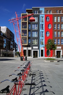 a row of bikes parked in front of a building