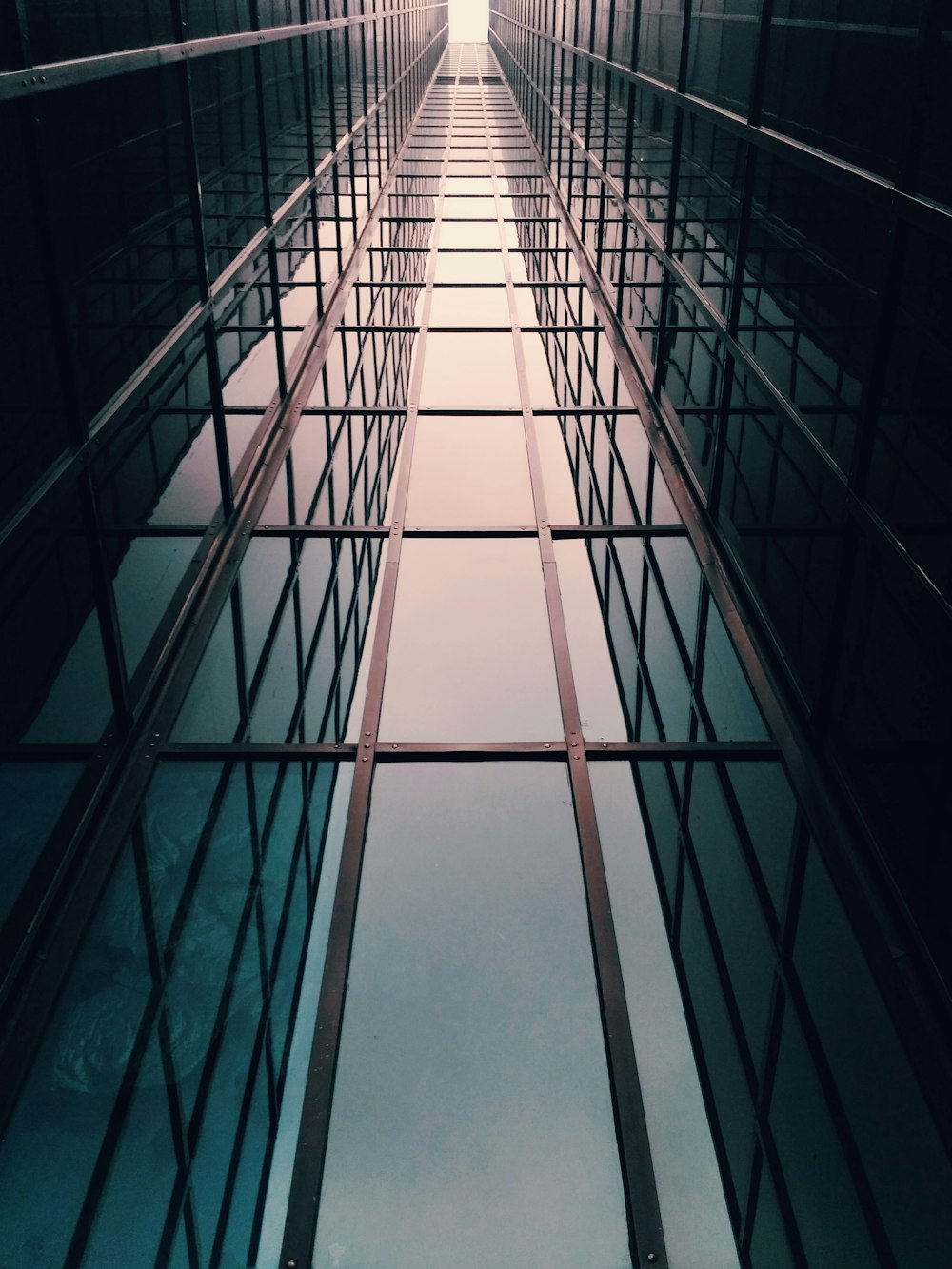 a very long hallway with lots of windows