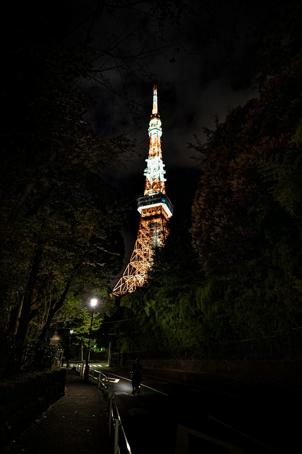 the eiffel tower is lit up at night