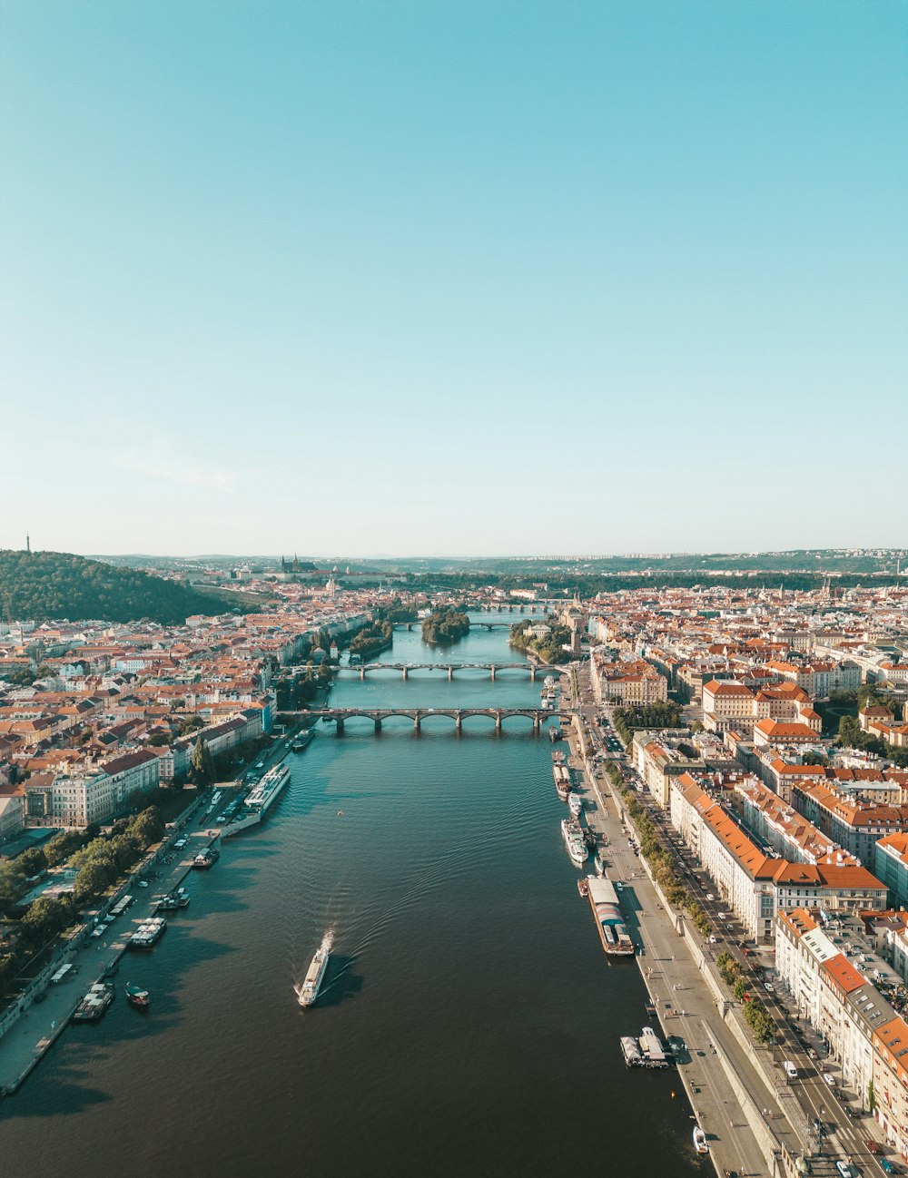 a river running through a city next to a bridge