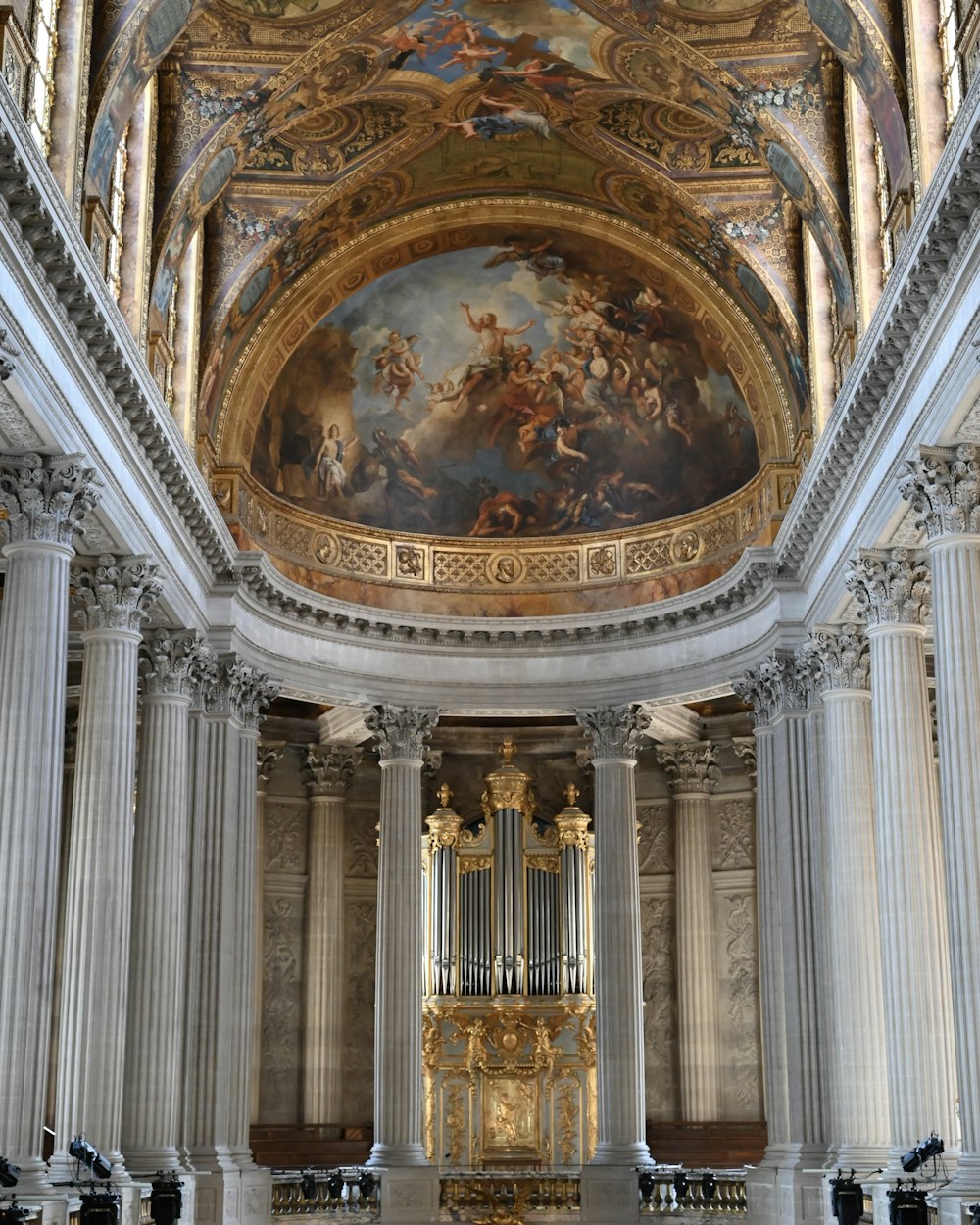 a large cathedral with a painting on the ceiling