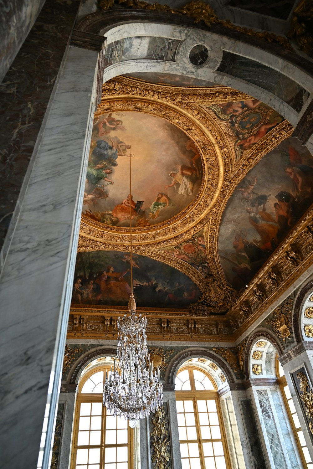 a chandelier hanging from the ceiling of a room