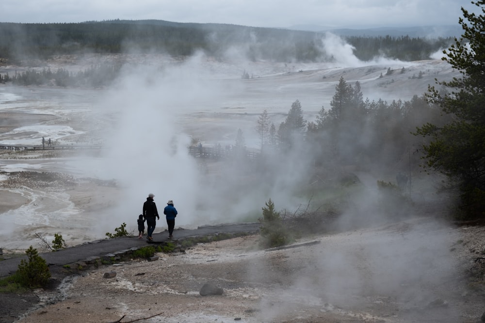 a couple of people that are standing in the dirt