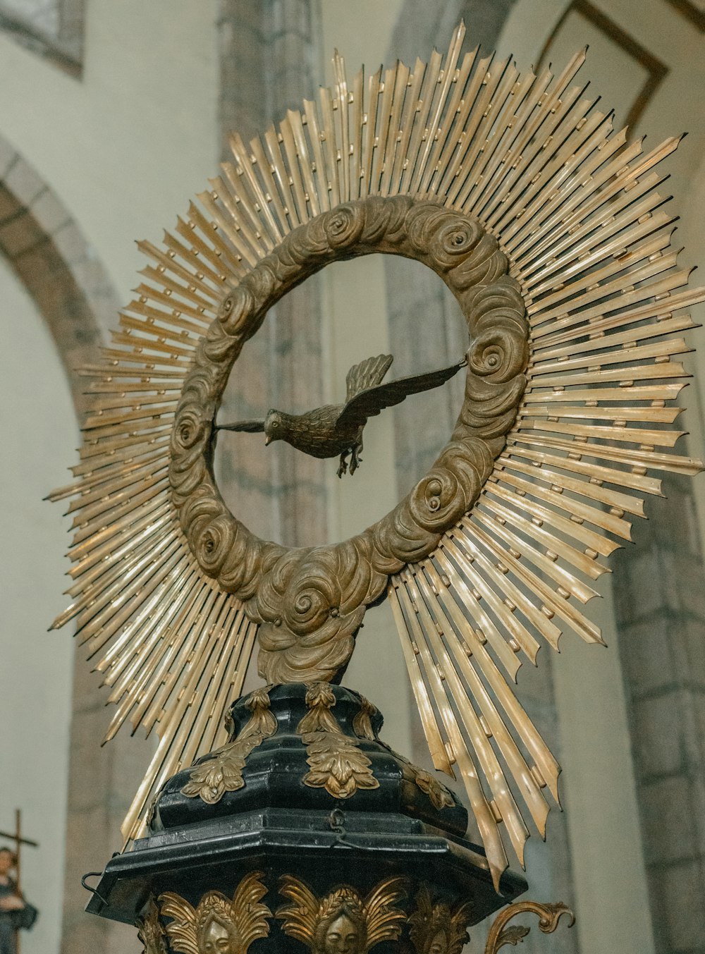 a statue of a bird in the center of a building