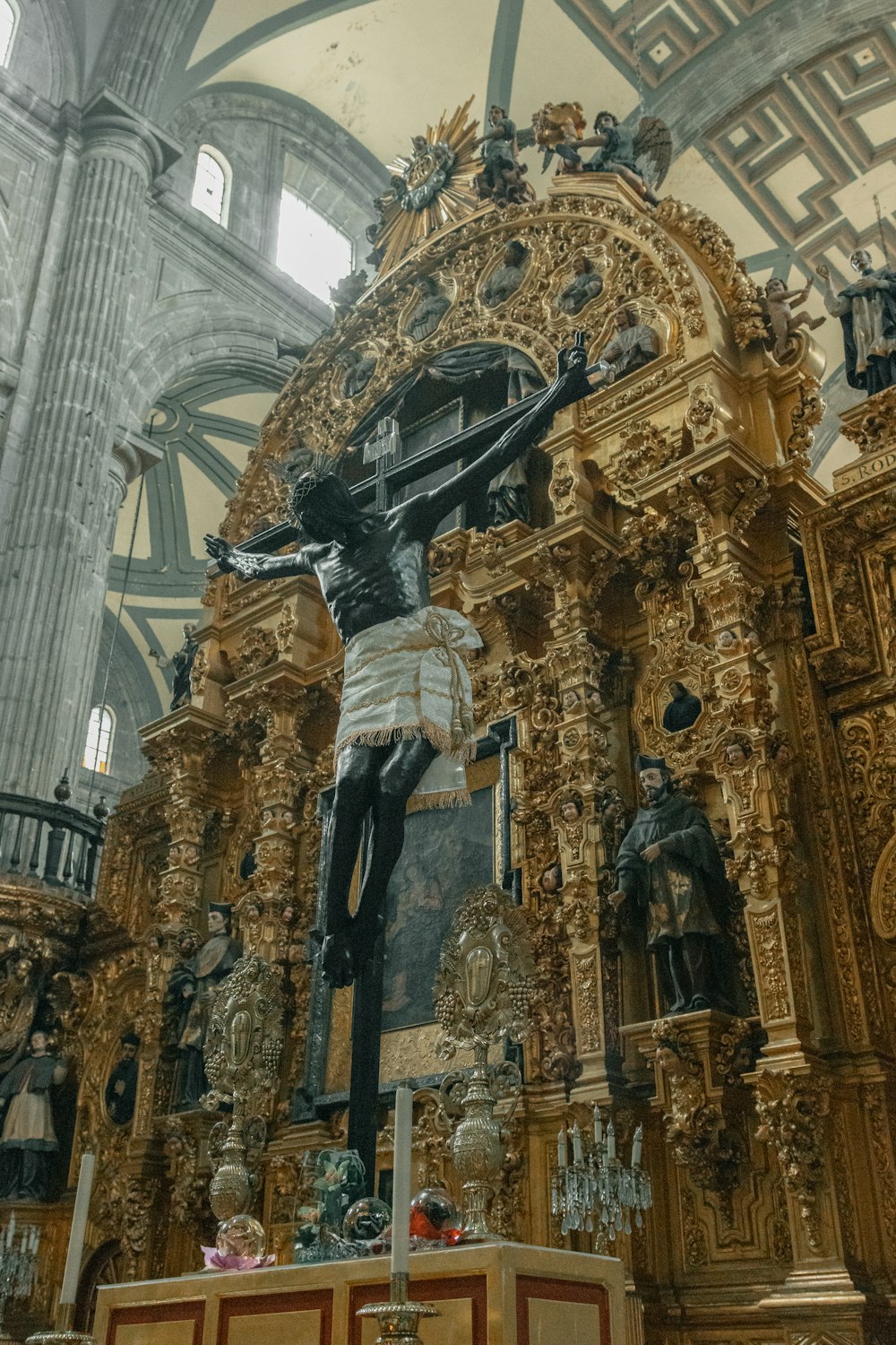 a statue of jesus on the cross in a church