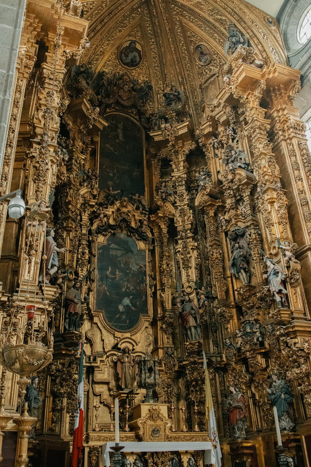 a large ornate church with a clock on the wall