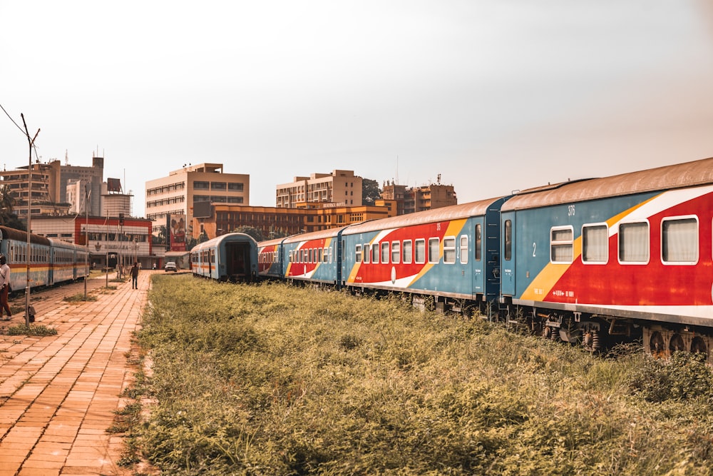 a train on a train track in a city