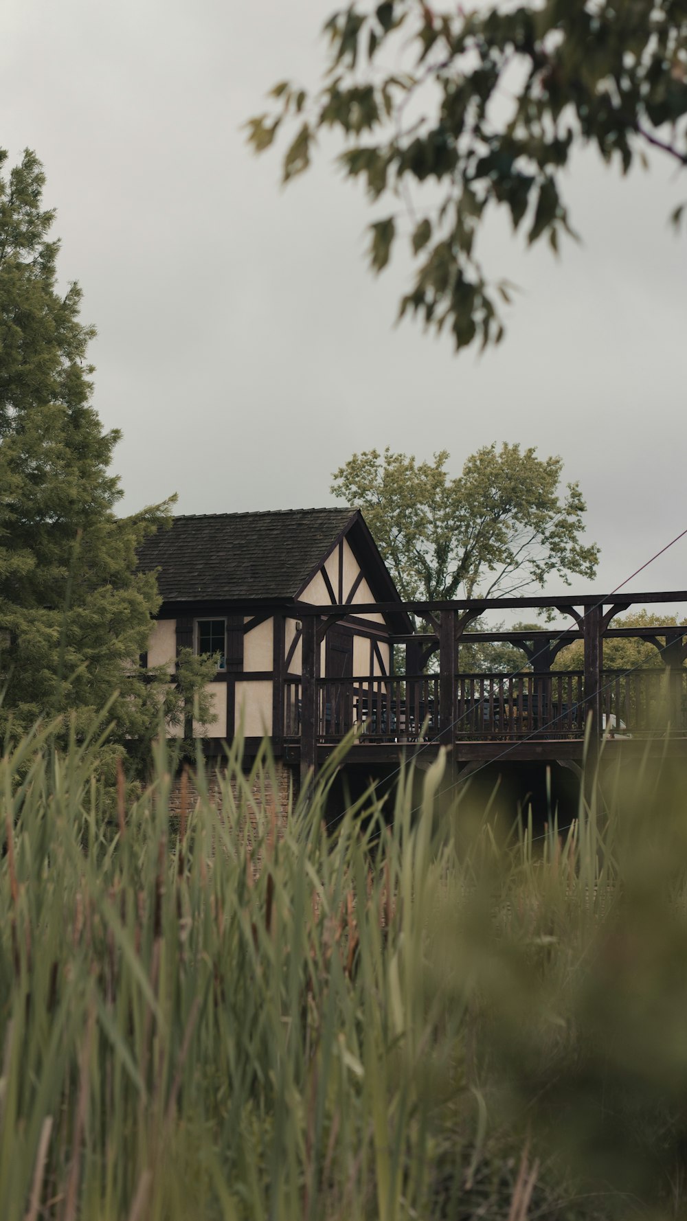 a house sitting on top of a lush green field