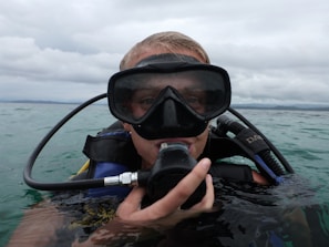 Close-up of a scuba diver practicing skills in a pool, preparing for real ocean research.