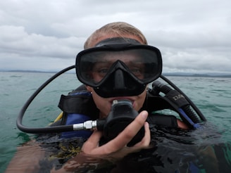 Close-up of a scuba diver practicing skills in a pool, preparing for real ocean research.