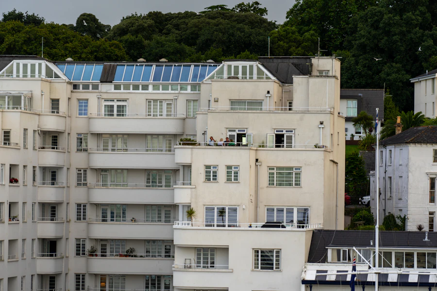 Apartment buildings along the waterside with a boat moored in front