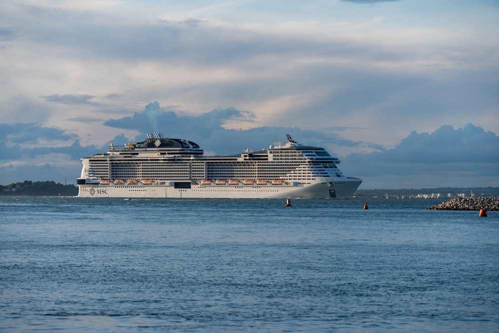 a large cruise ship in the middle of a body of water