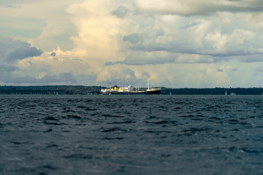 a large boat floating on top of a large body of water