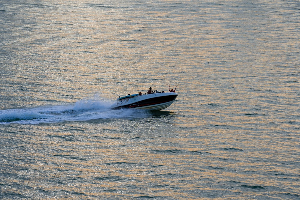 a speed boat is speeding across the water