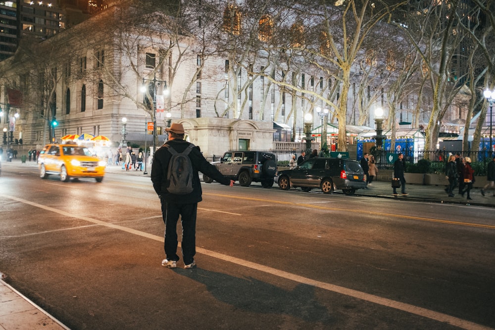 a man standing in the middle of a street