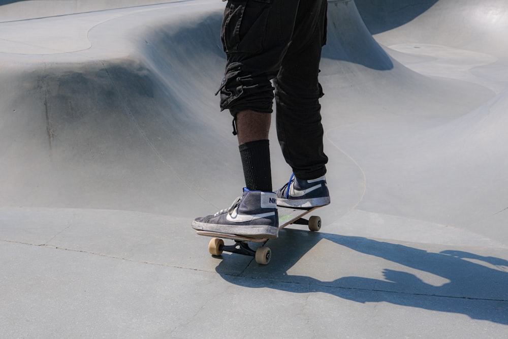 a person riding a skateboard at a skate park