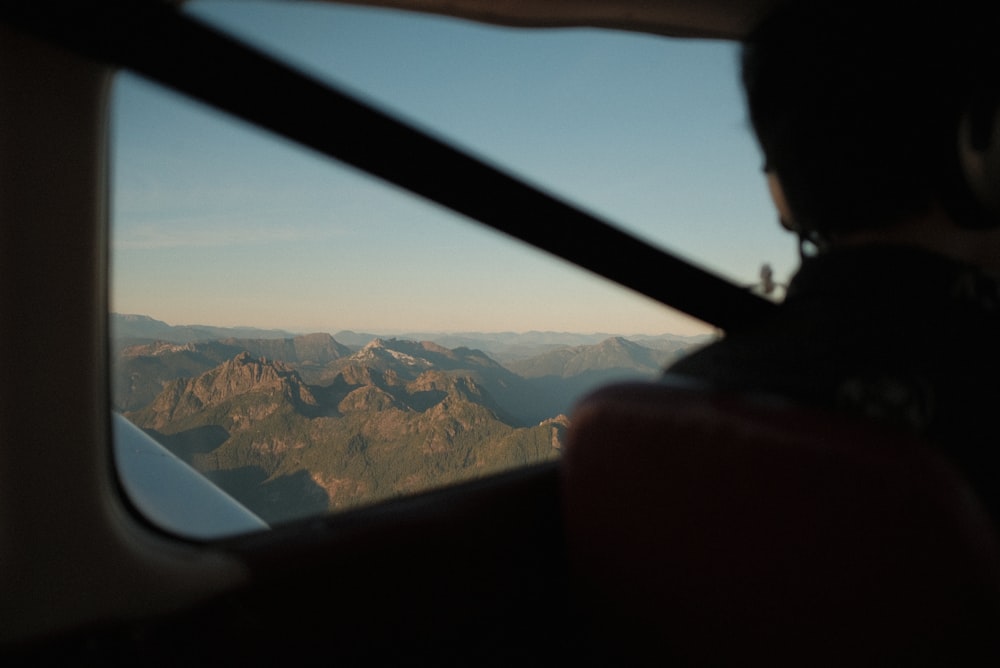 a view of mountains from a plane window