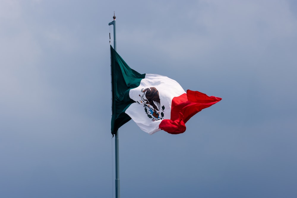 a mexican flag flying in the wind