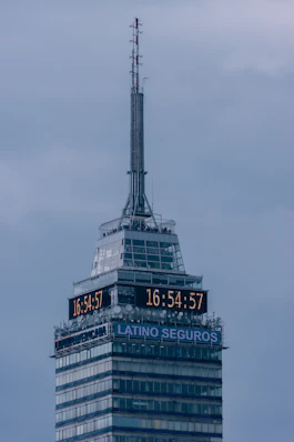 a tall building with a clock on the top of it