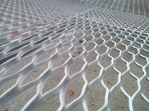 A close-up of galvanized fencing installed around a farm in Saudi Arabia.