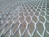 Detailed shot of textured FRP mesh used in reinforcing concrete structures.