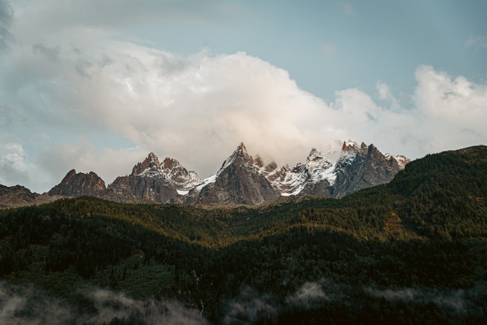 a view of a mountain range with clouds in the sky