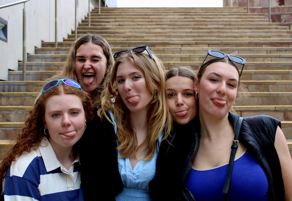 a group of young women standing next to each other