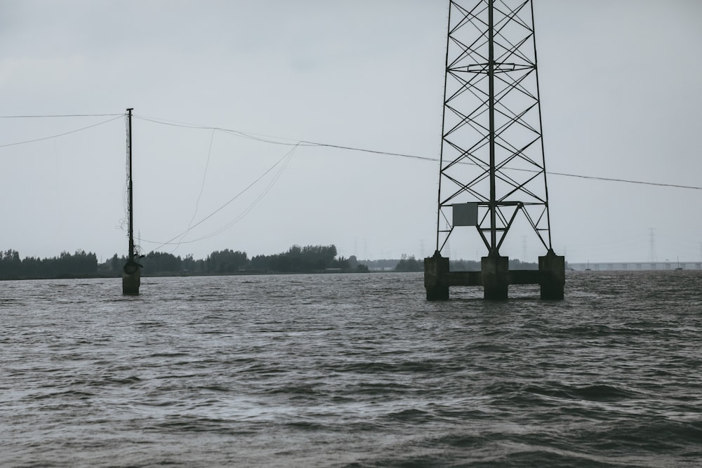 a large body of water with power lines above it