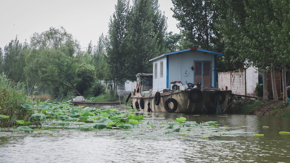 a house on a boat in a body of water