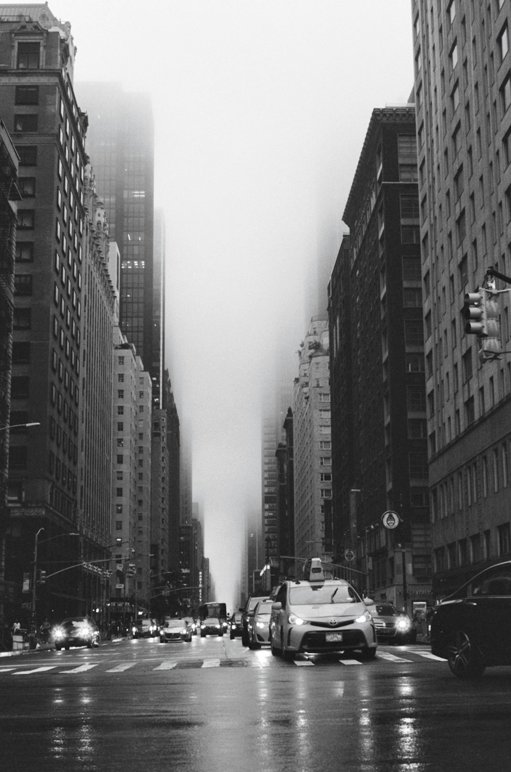 a city street filled with lots of tall buildings