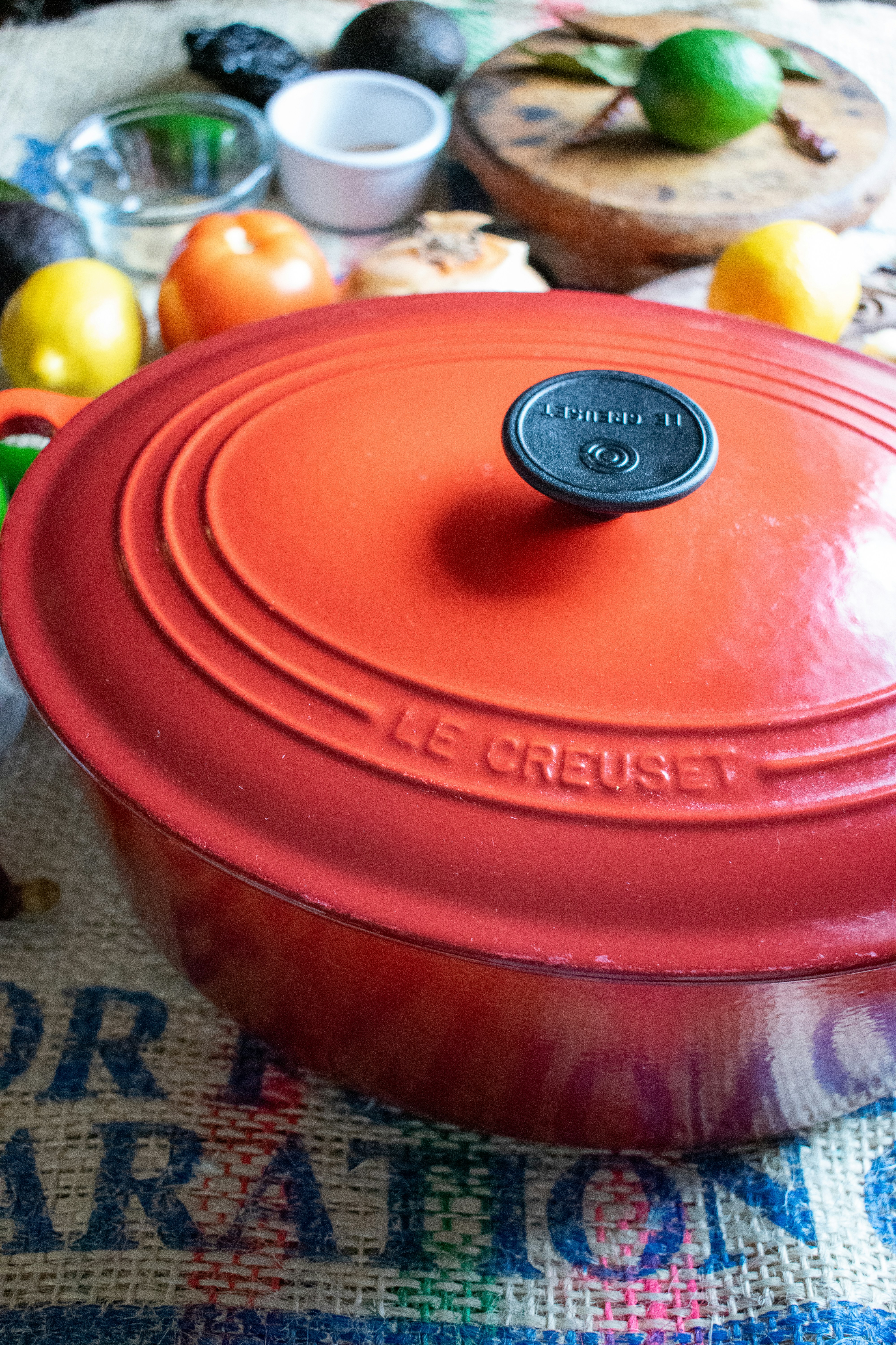 a red pot sitting on top of a table