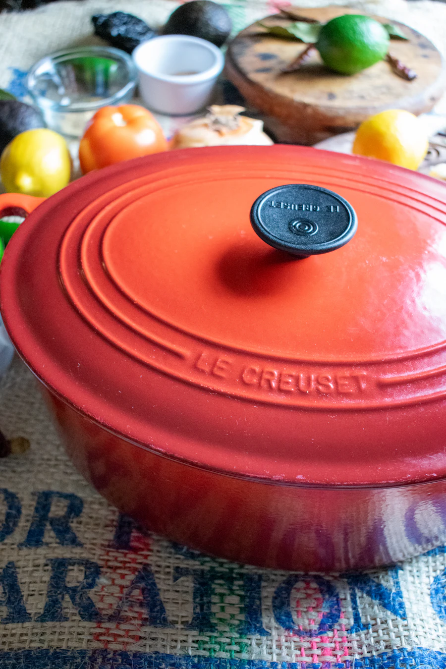 Red enameled pot on a kitchen table (representative photo)