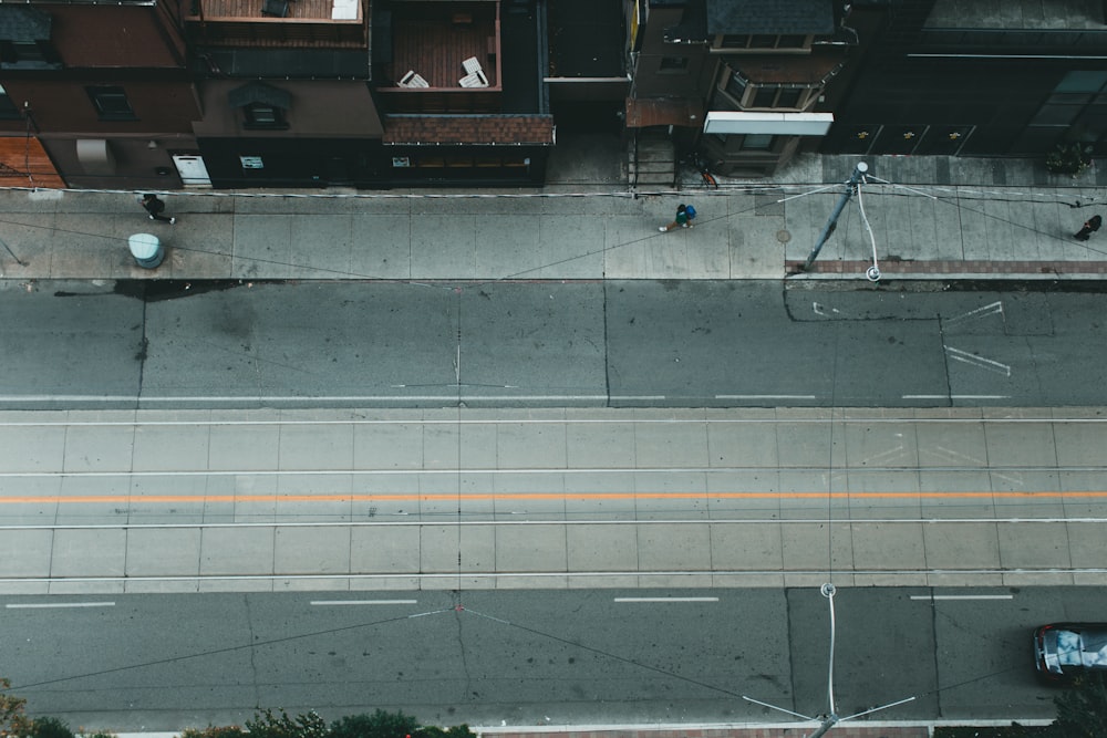 an overhead view of a city street with cars