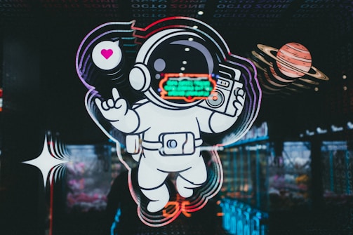 A vibrant neon-blue and pink glowing galaxy background with a stylized alien holding a communication device.
