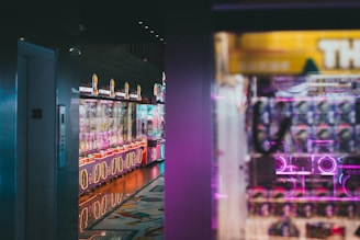 A stylish claw machine glowing softly in a chic event space with guests enjoying the game.