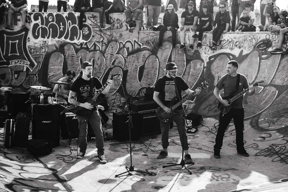 a group of men standing next to each other on a stage