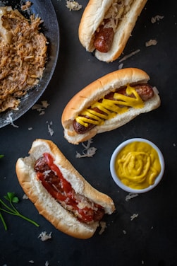a couple of hot dogs sitting on top of a table