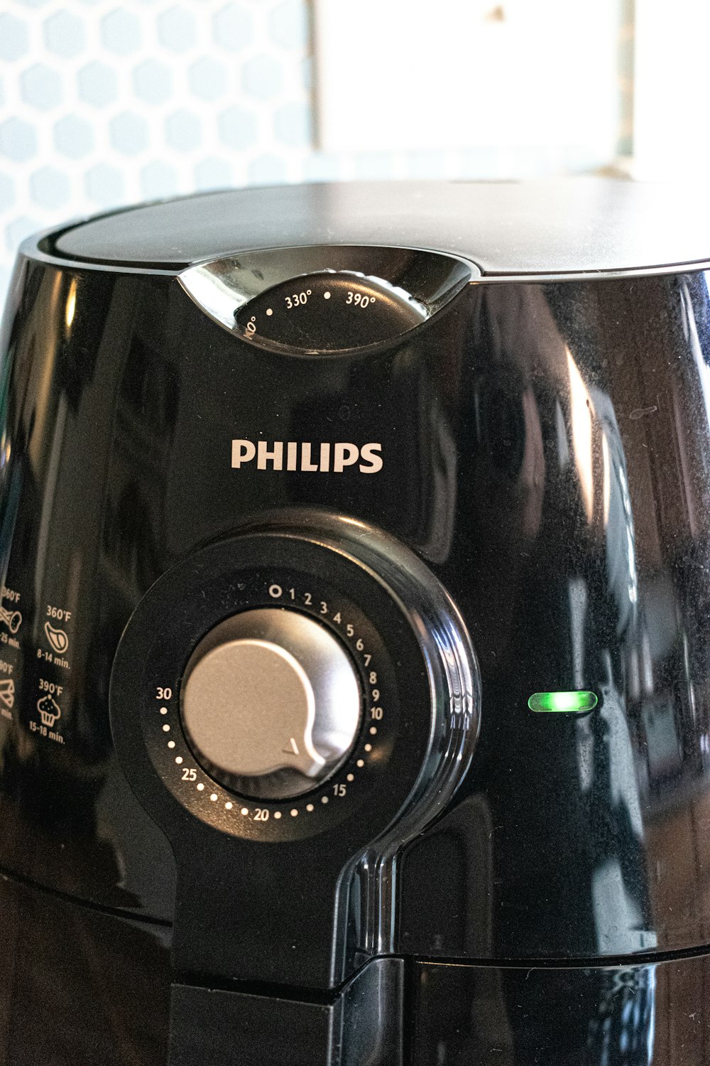 a close up of a black blender on a table