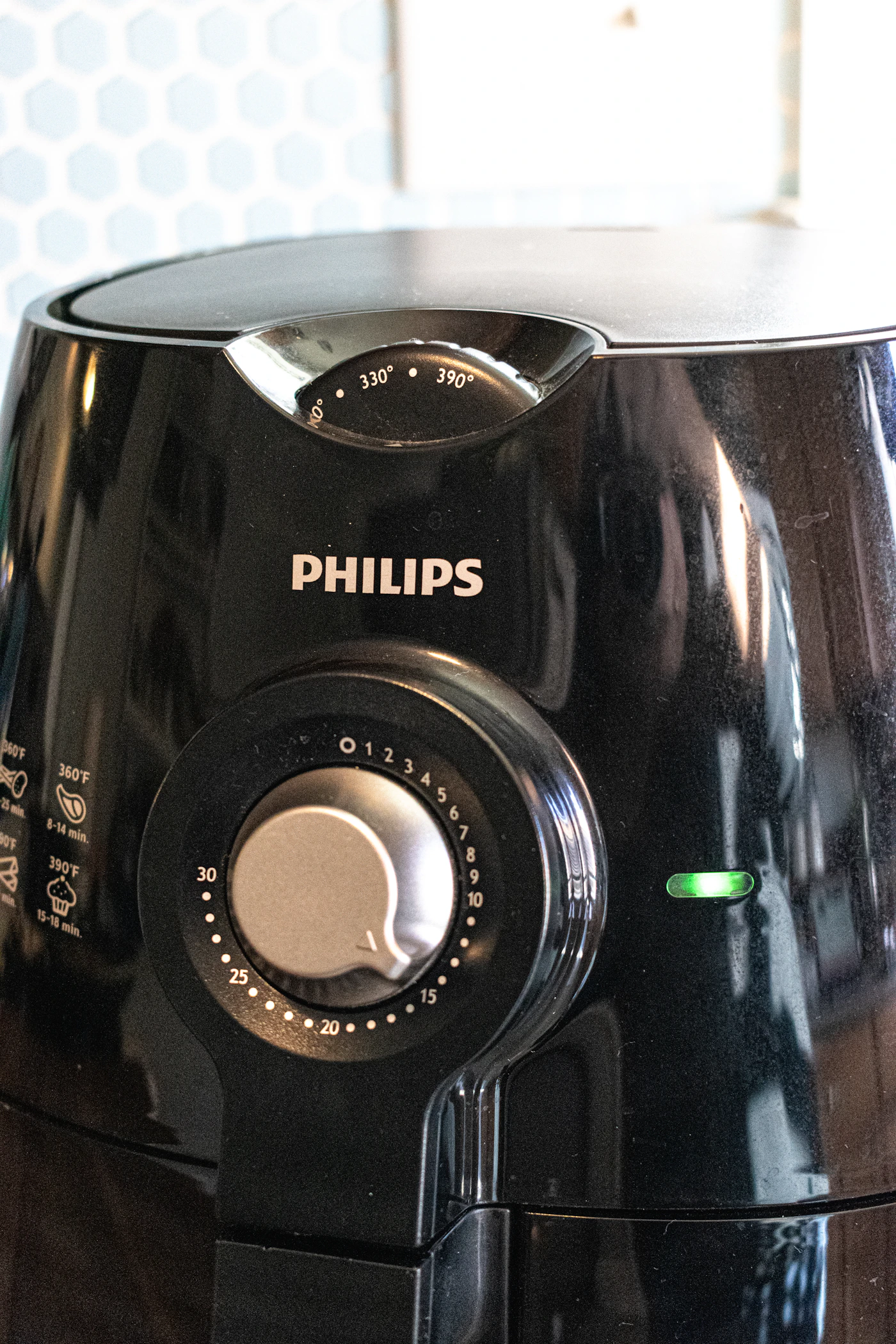 Modern black air fryer photographed as a contemporary kitchen appliance