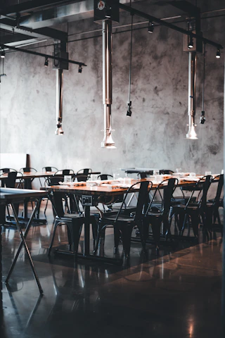 Minimalist dining room featuring Montana Industrial's sleek steel and wood furniture.