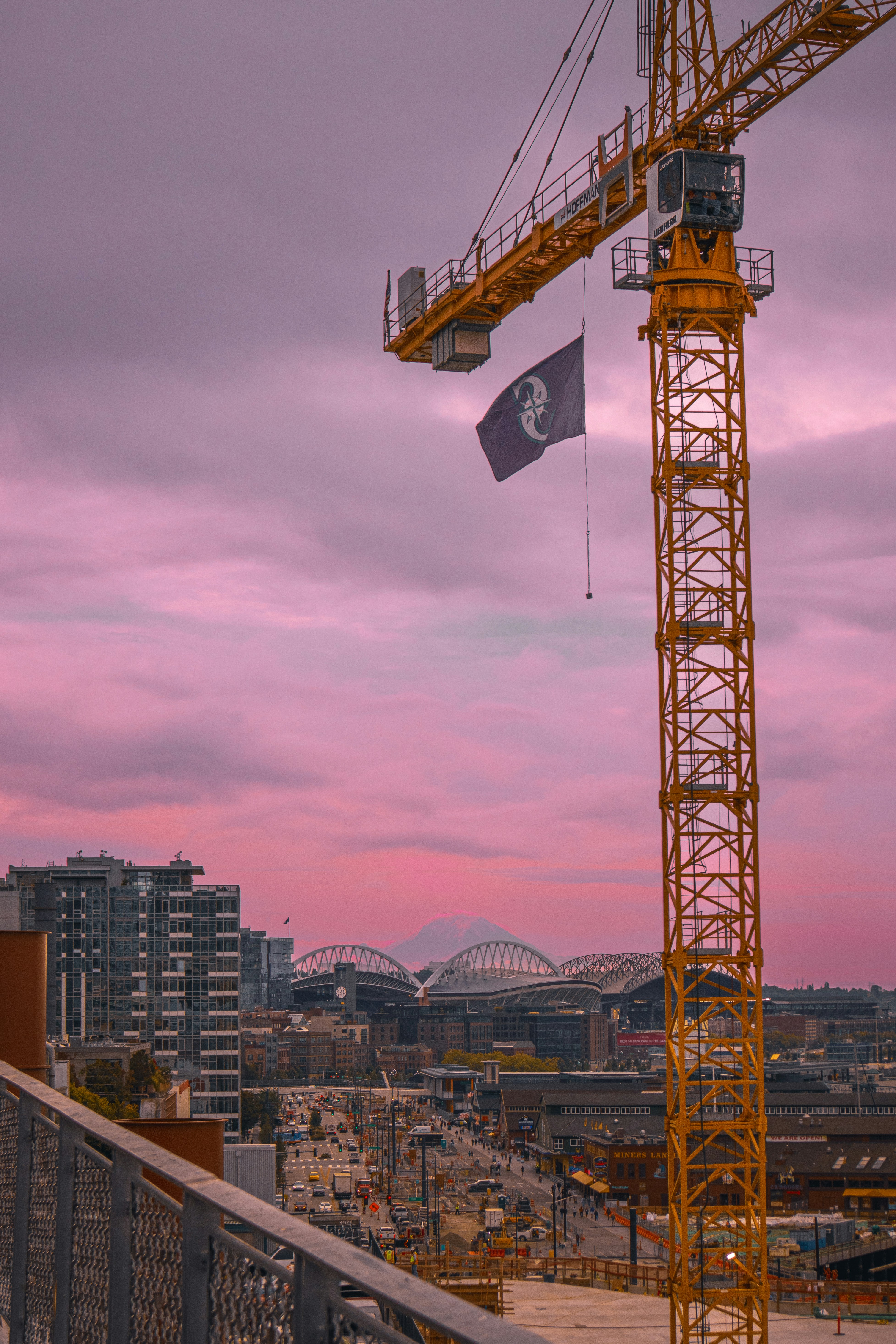 a yellow crane is on top of a building