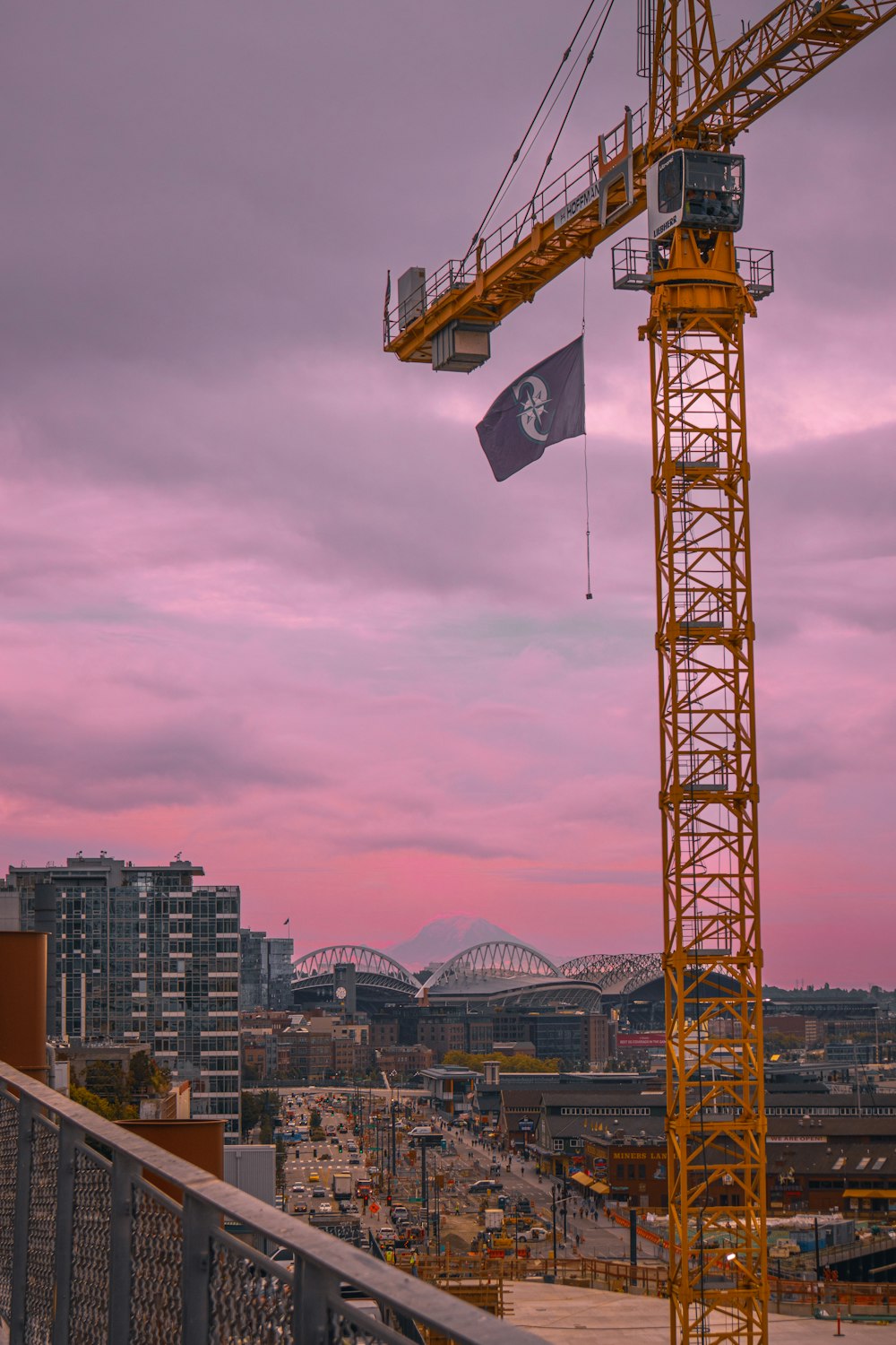 a yellow crane is on top of a building