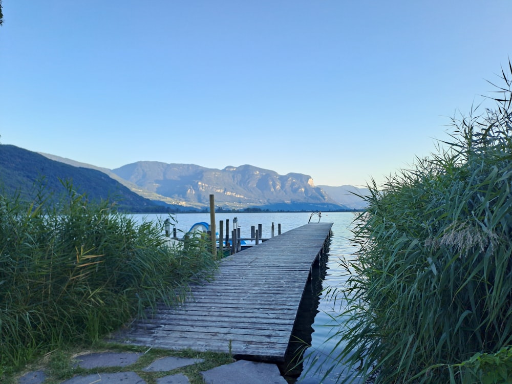 a wooden dock sitting next to a body of water