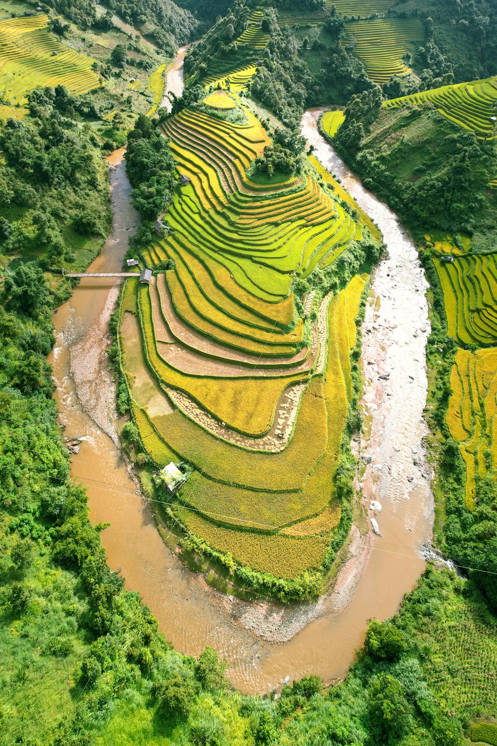 a river running through a lush green valley