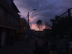 A cinematic photo shoot capturing a vibrant Tijuana street scene at sunset.