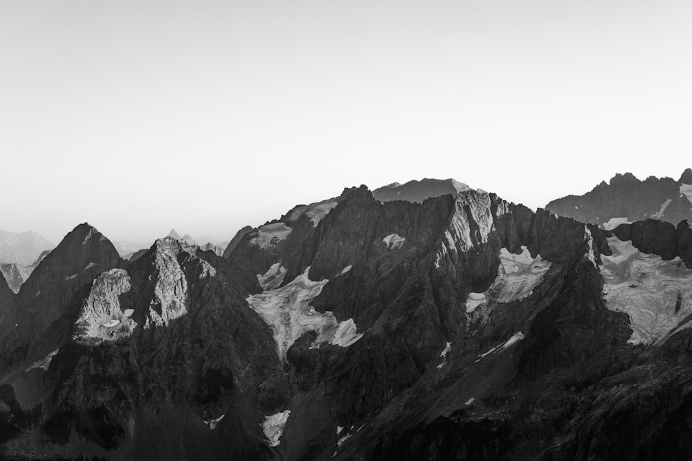 a black and white photo of a mountain range