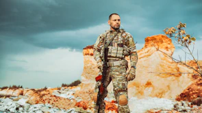CRPF soldier wearing black jungle shoes standing confidently on jungle terrain.