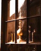 Seasonal decorative items arranged on a windowsill with soft sunlight.